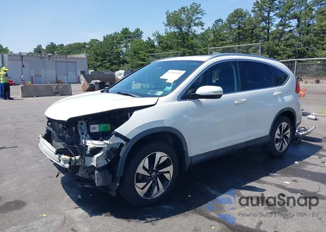 2015 Honda Cr-V Touring z USA, uszkodzony, nr VIN 5J6RM4H92FL116338